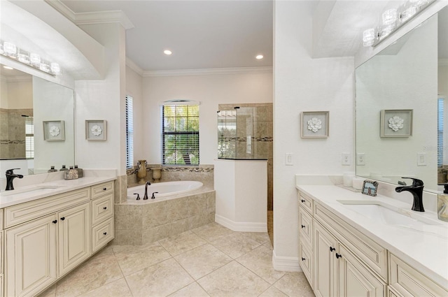 bathroom with vanity, tile patterned floors, ornamental molding, and plus walk in shower