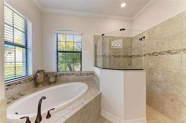 bathroom featuring a wealth of natural light, ornamental molding, and separate shower and tub