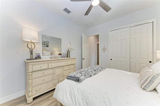 bedroom with ceiling fan, a closet, and light wood-type flooring