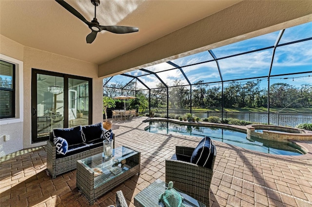 view of patio / terrace featuring a water view, outdoor lounge area, a lanai, a pool with hot tub, and ceiling fan