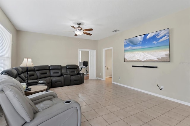 living room with light tile patterned floors and ceiling fan