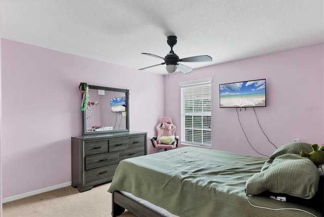 bedroom featuring light carpet and ceiling fan