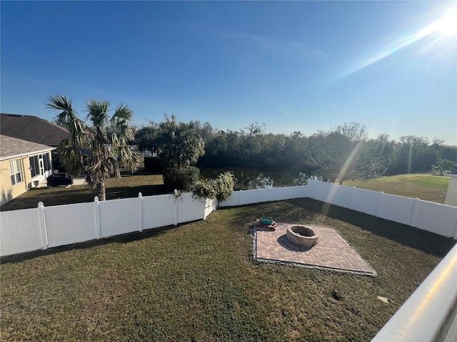 view of yard with a fire pit