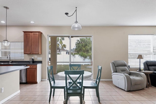 tiled dining area featuring sink