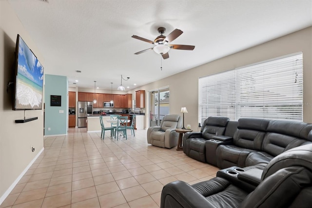 living room with light tile patterned flooring and ceiling fan