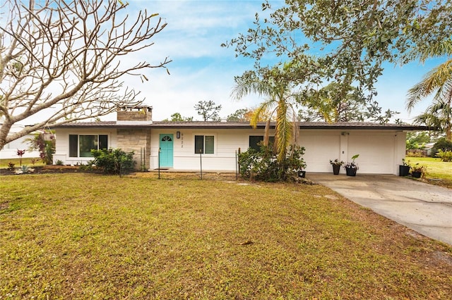 ranch-style house with a front yard and a garage