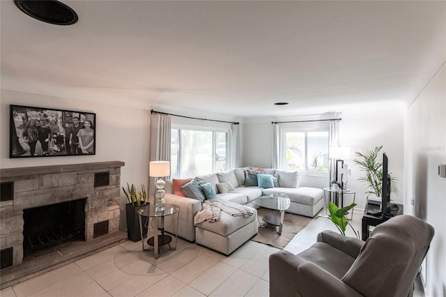 living room featuring light tile patterned floors and a fireplace