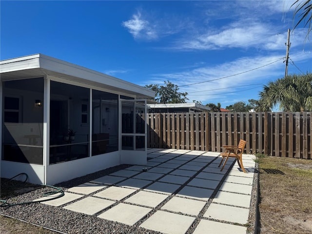 view of patio / terrace featuring a sunroom