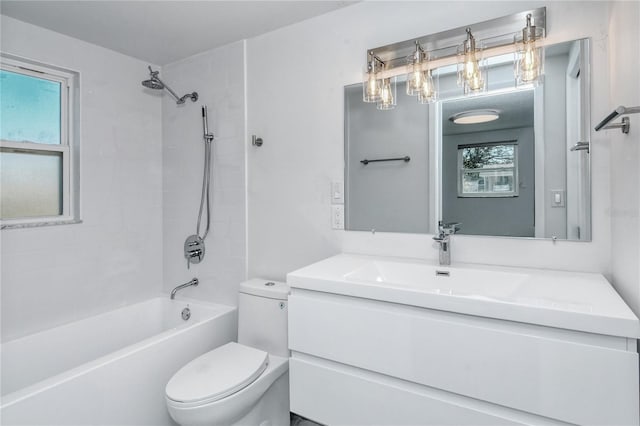 full bathroom with tiled shower / bath combo, vanity, and toilet