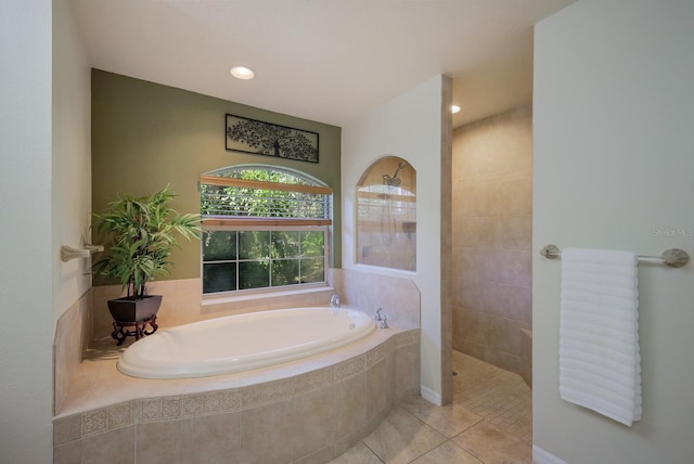 bathroom with tile patterned floors and separate shower and tub