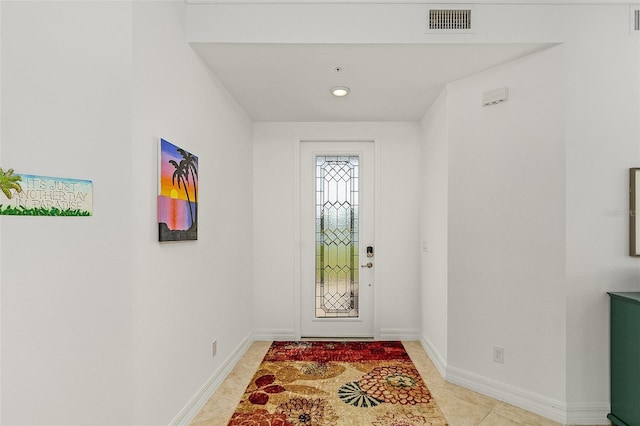 foyer with light tile patterned flooring