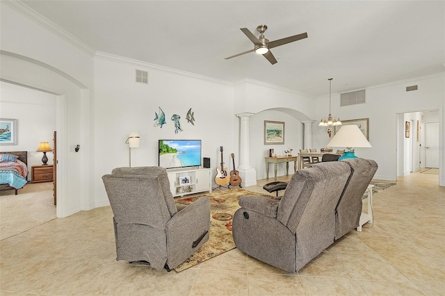 living room featuring crown molding, ceiling fan with notable chandelier, light tile patterned flooring, and decorative columns