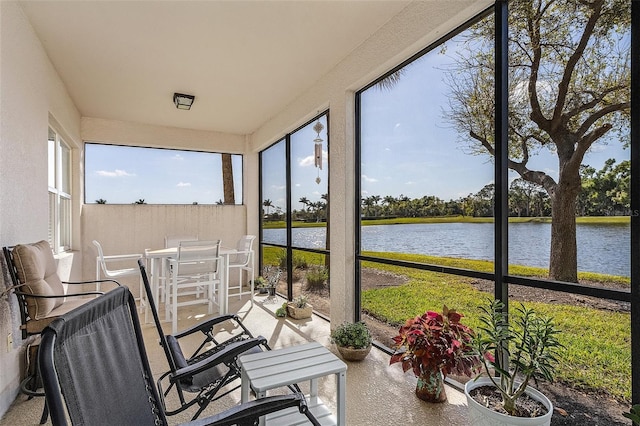 sunroom / solarium with a water view