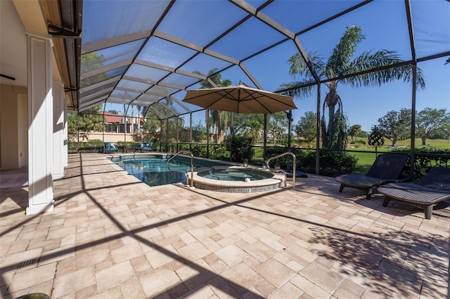 view of pool with an in ground hot tub, a lanai, and a patio