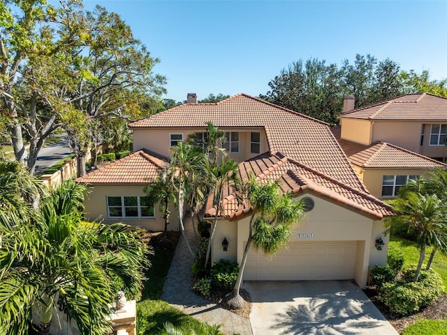 mediterranean / spanish-style home featuring a garage