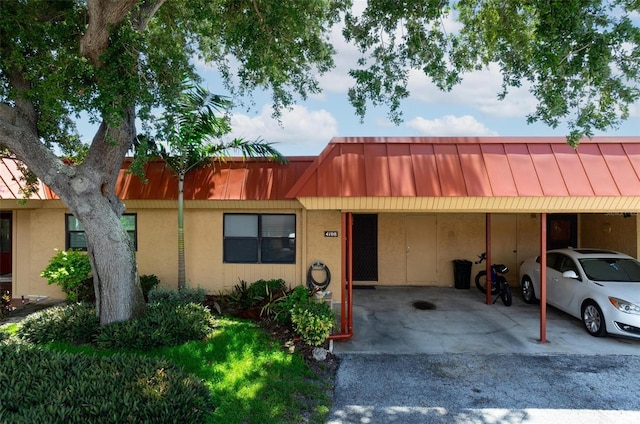 ranch-style home with a carport