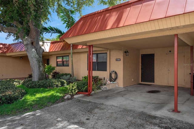 exterior space with a carport