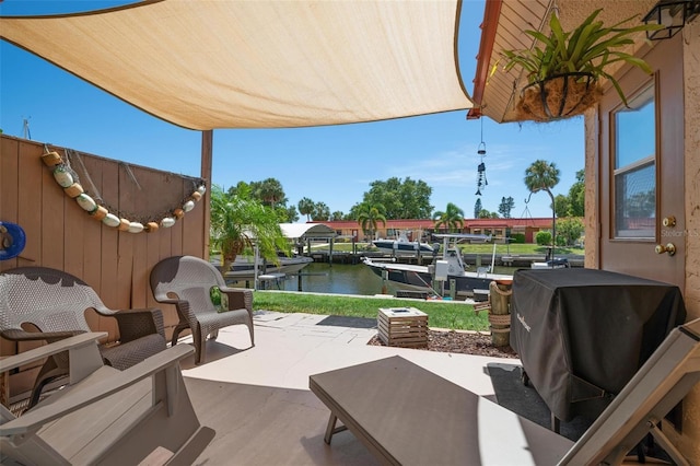 view of patio featuring a dock and a water view