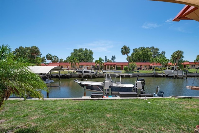 dock area featuring a water view and a yard