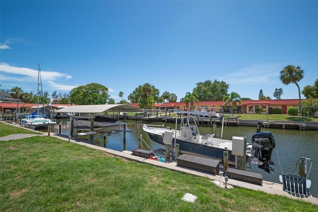 dock area with a water view and a yard