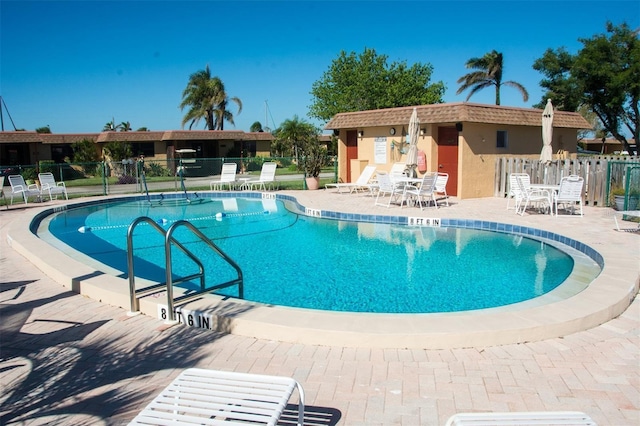 view of swimming pool with a patio