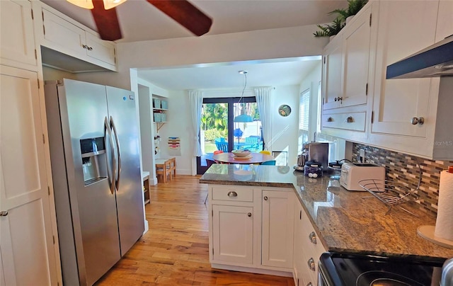 kitchen featuring white cabinetry, stainless steel appliances, and stone counters