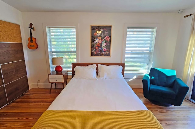 bedroom with hardwood / wood-style floors