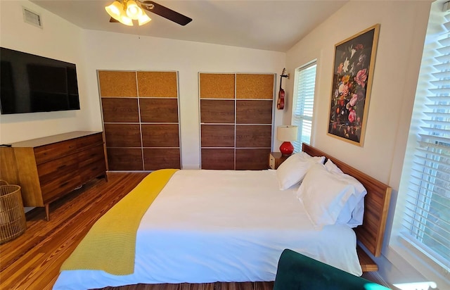 bedroom featuring dark wood-type flooring and ceiling fan