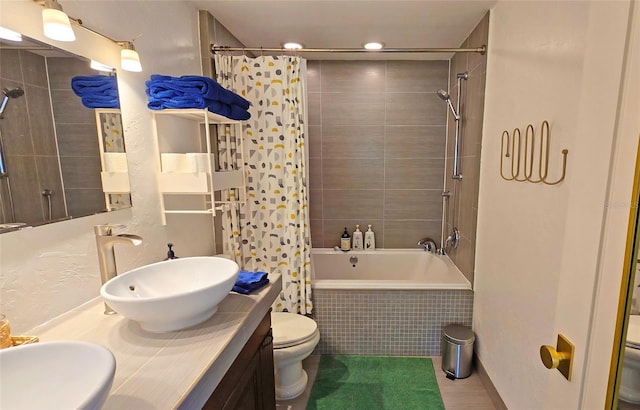 full bathroom featuring vanity, shower / bath combination with curtain, and toilet