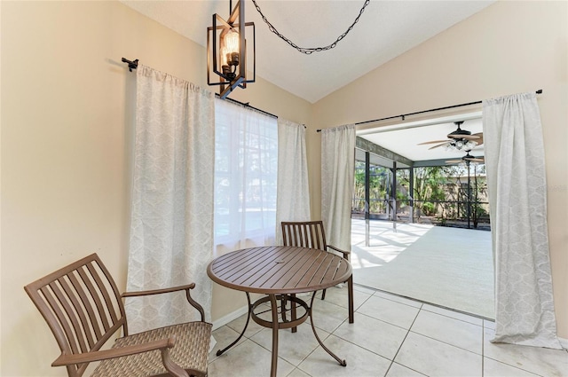 sitting room featuring vaulted ceiling and light tile patterned floors