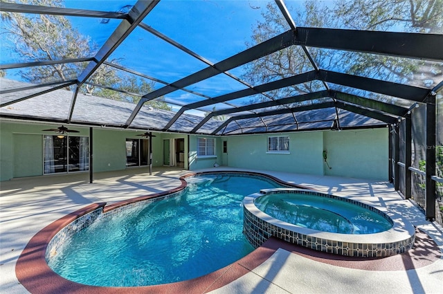 view of pool with an in ground hot tub, a lanai, ceiling fan, and a patio area