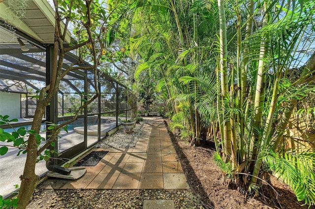 view of patio with a pool and a lanai