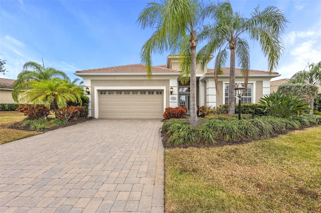 view of front facade featuring a garage and a front yard