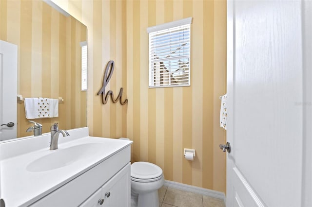 bathroom featuring toilet, tile patterned floors, and vanity