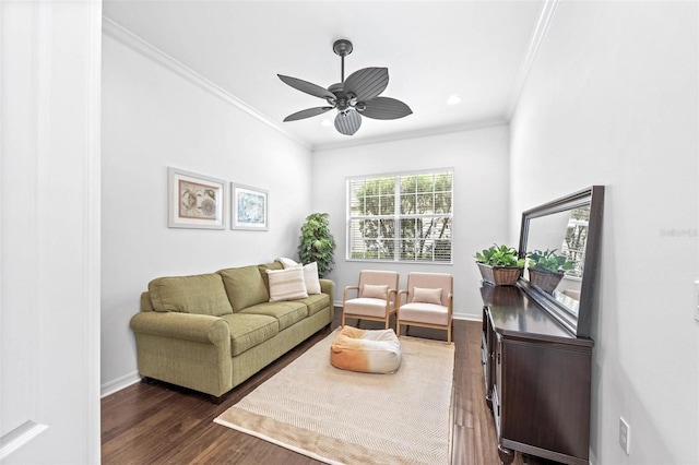 living room with ceiling fan, crown molding, and dark hardwood / wood-style floors