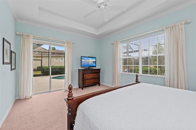 bedroom with access to exterior, a raised ceiling, ceiling fan, and carpet floors