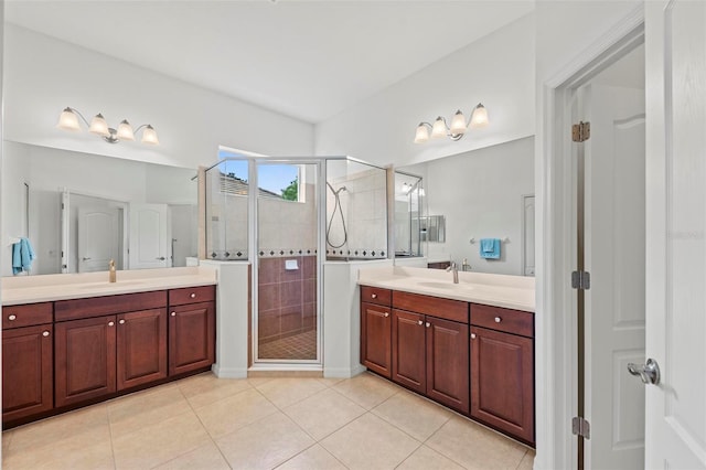 bathroom featuring walk in shower, vanity, and tile patterned flooring