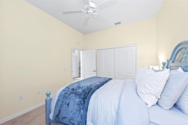 carpeted bedroom with a closet and ceiling fan