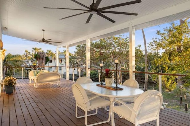 sunroom featuring ceiling fan