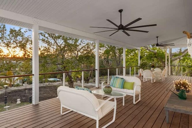 sunroom / solarium with ceiling fan