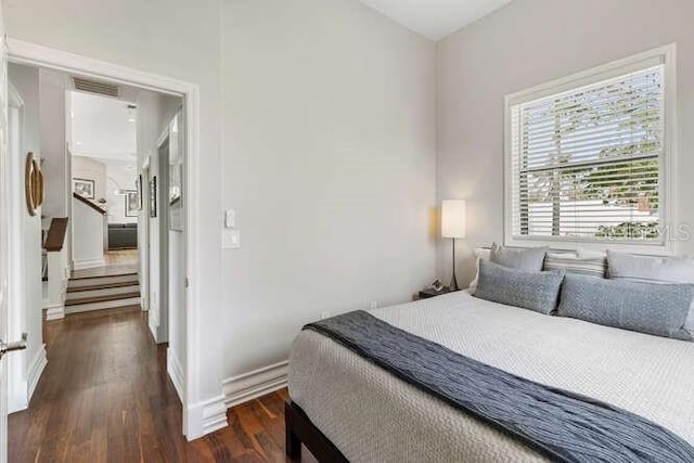 bedroom featuring dark hardwood / wood-style floors