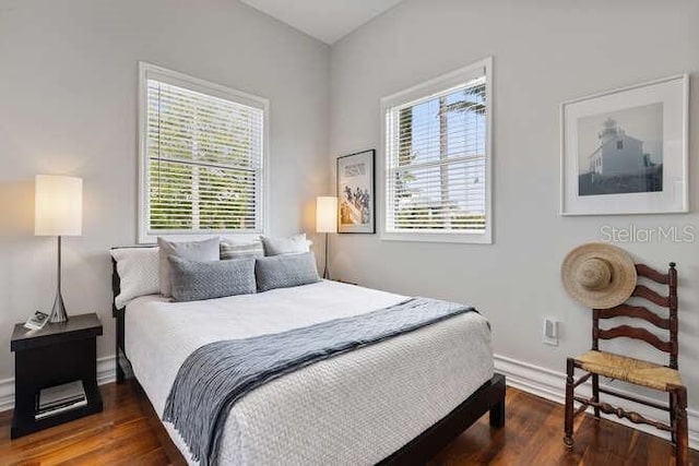 bedroom featuring dark wood-type flooring