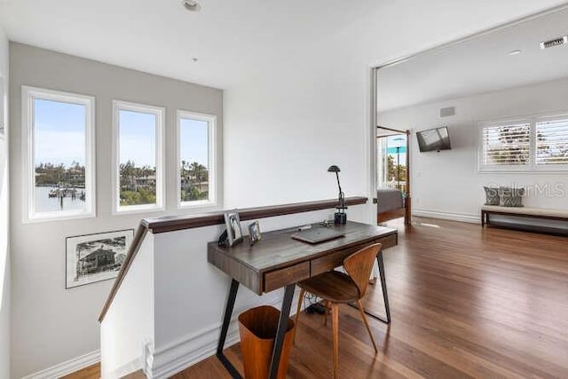 dining room with dark wood-type flooring