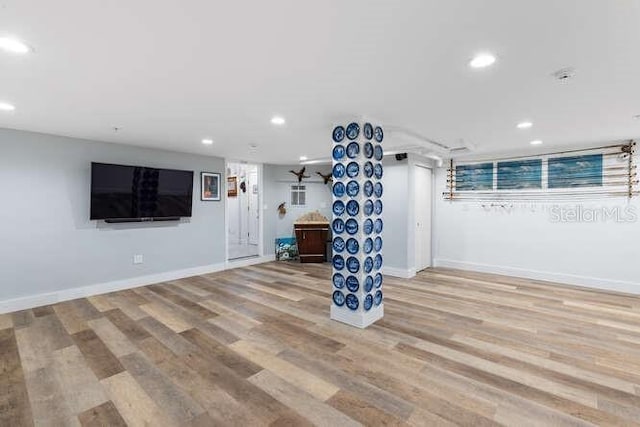 basement featuring light hardwood / wood-style floors