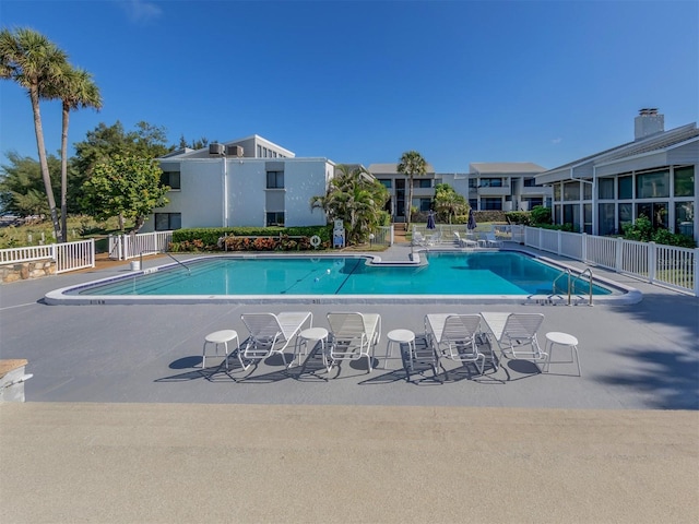 view of swimming pool with a patio