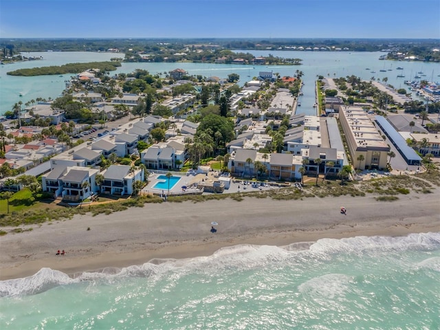 bird's eye view with a beach view and a water view