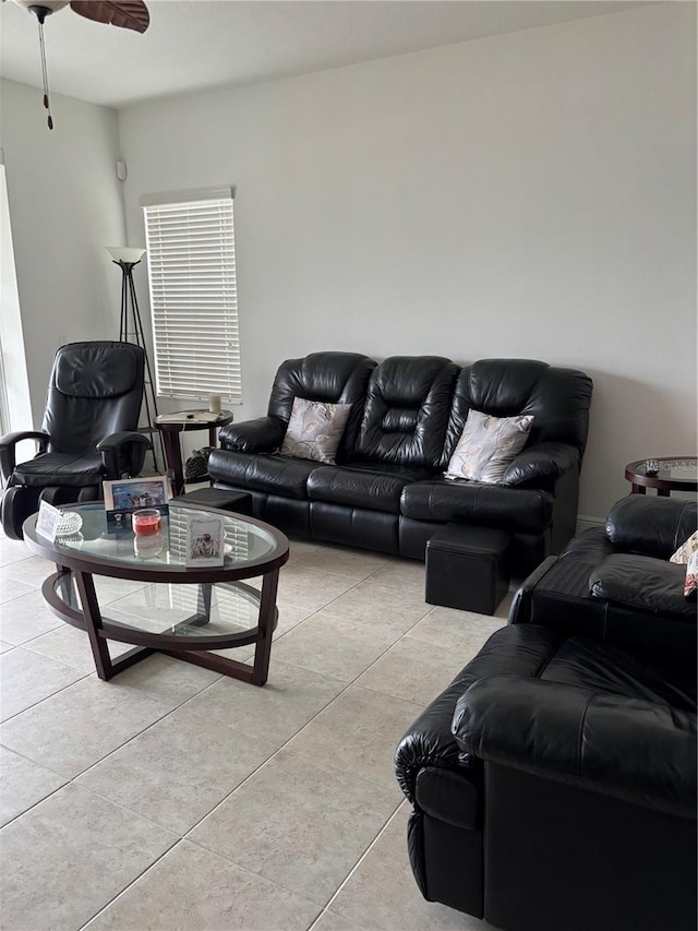 tiled living room with ceiling fan