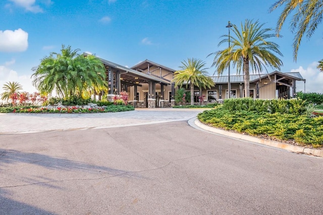 view of property with curved driveway