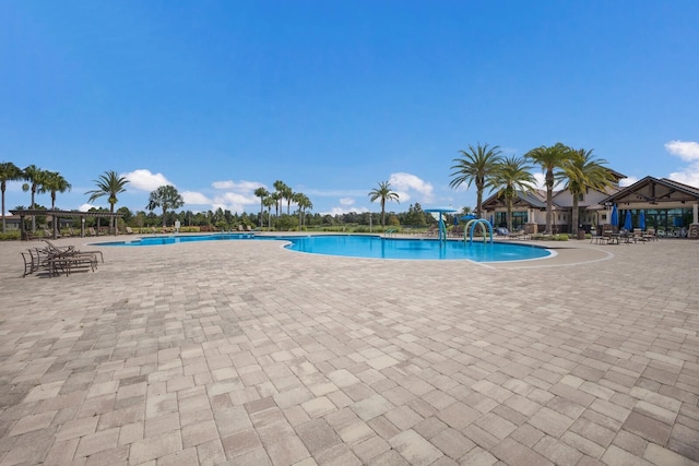 community pool featuring a patio area