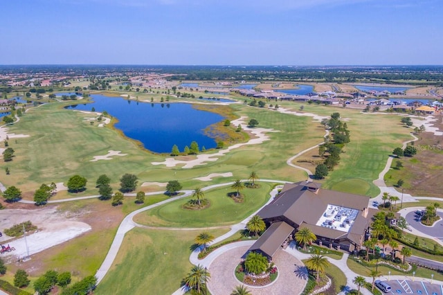 birds eye view of property featuring golf course view and a water view